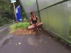 Sexy girl power pissing public flashing at bus stop